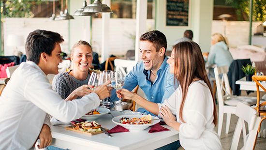 People at restaurant enjoying a meal