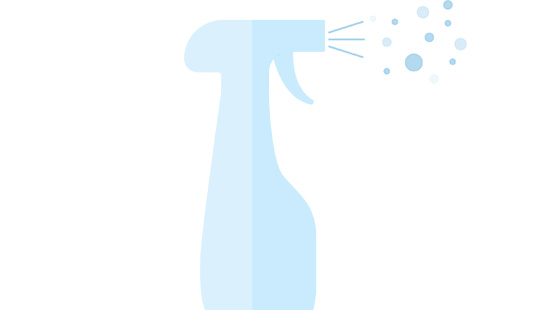 spray bottle spraying cleaning solution