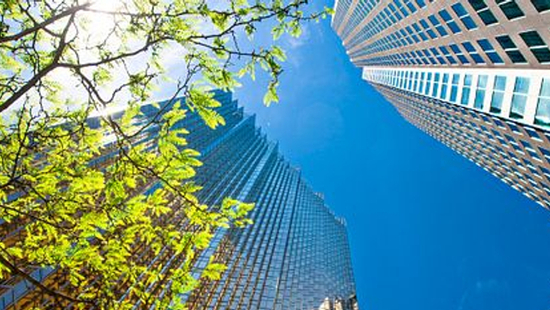 looking up at large sky scrapers